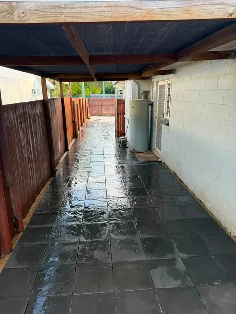 A covered side access in dark slate look pavers
