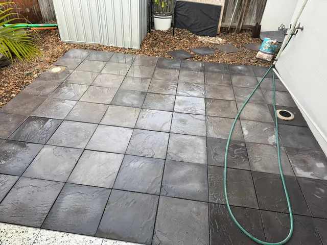 A tidy outdoor area finished in charcoal pavers